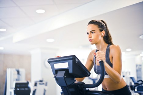 A woman running at the gym.